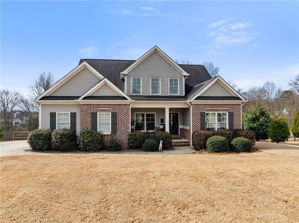 5716 Brickhampton Court Clermont, GA 30527 - Photo 1 of 42 a front view of a house with a yard