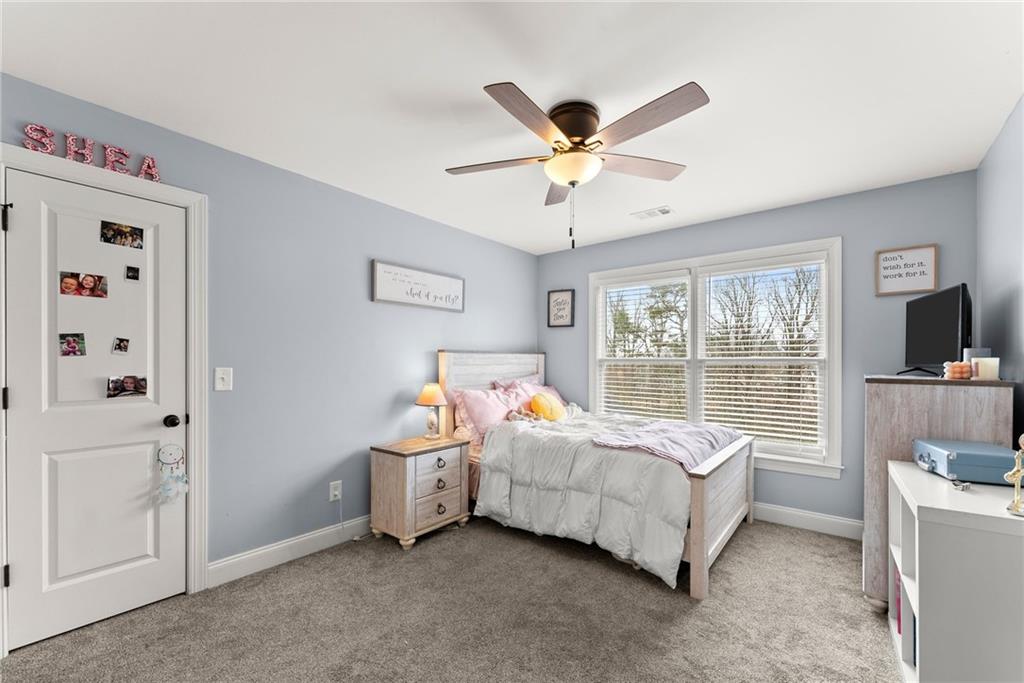 5716 Brickhampton Court Clermont, GA 30527 - Photo 21 of 42 a bed room with a bed and a window