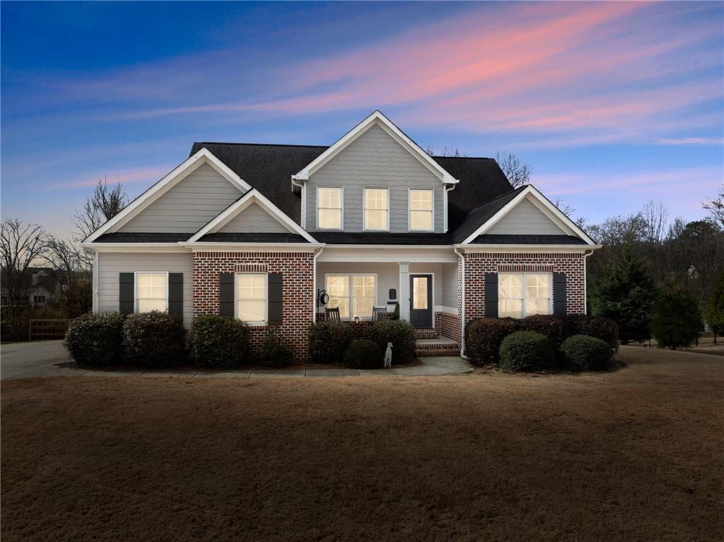 5716 Brickhampton Court Clermont, GA 30527 - Photo 27 of 42 a front view of a house with a yard
