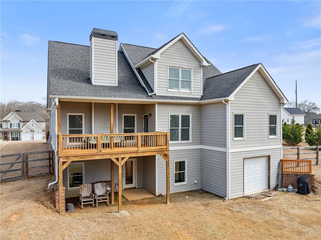 5716 Brickhampton Court Clermont, GA 30527 - Photo 29 of 42 a view of a house with a yard and sitting space