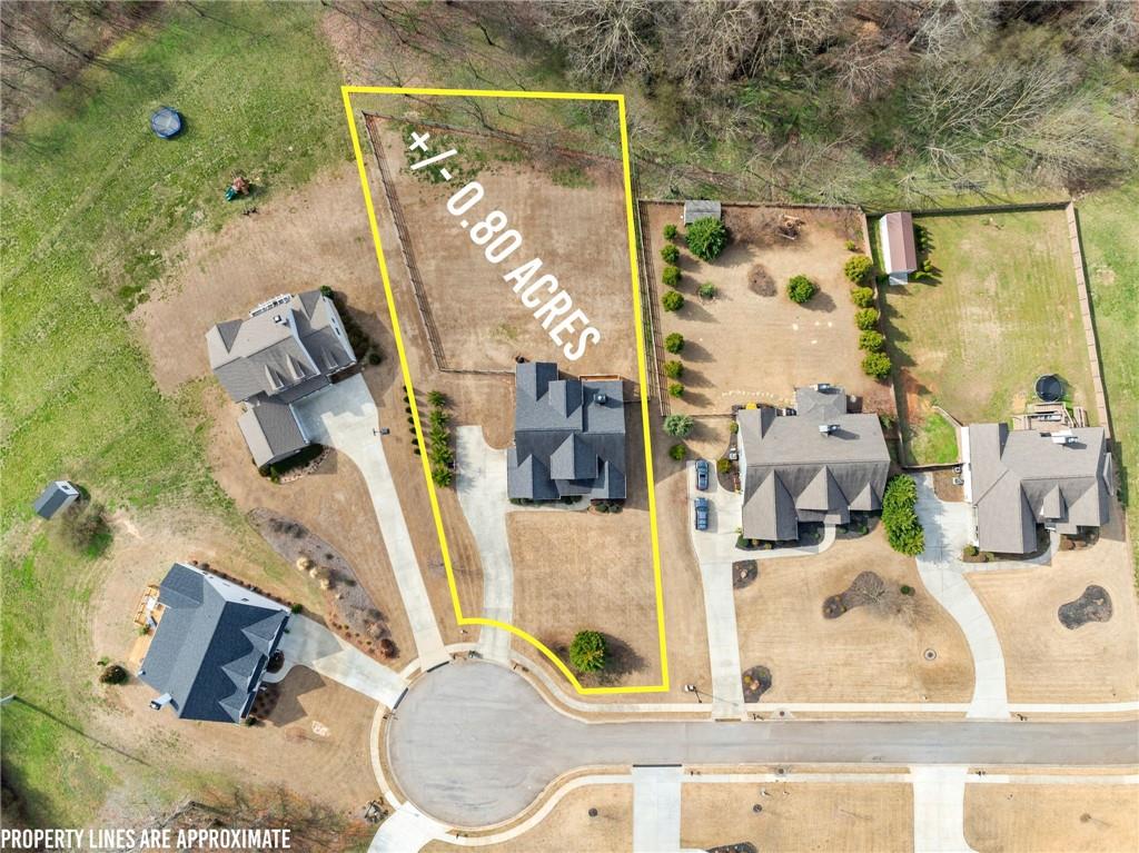 5716 Brickhampton Court Clermont, GA 30527 - Photo 3 of 42 an aerial view of residential house with outdoor space and swimming pool