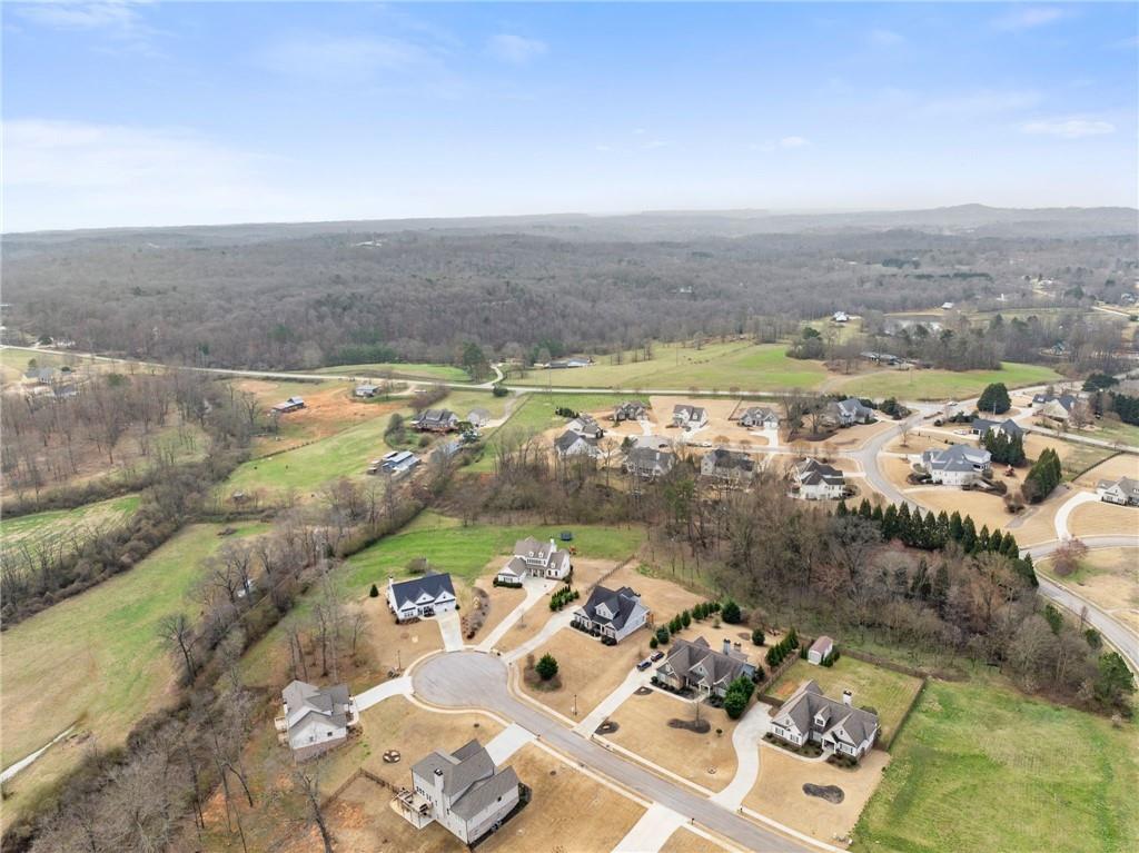 5716 Brickhampton Court Clermont, GA 30527 - Photo 39 of 42 an aerial view of a house with a ocean view