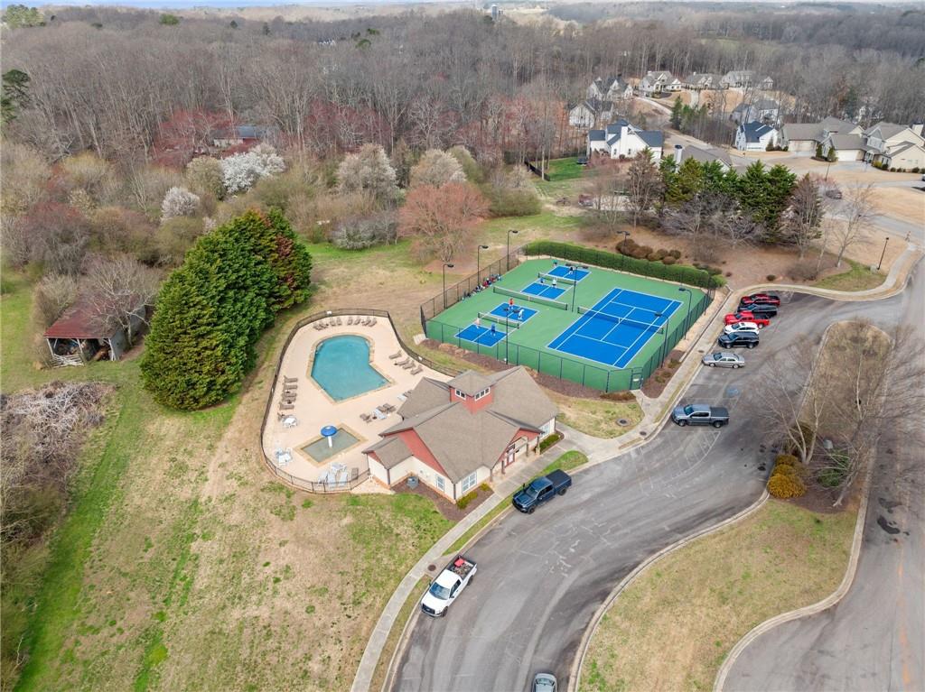 5716 Brickhampton Court Clermont, GA 30527 - Photo 40 of 42 an aerial view of a house with a swimming pool