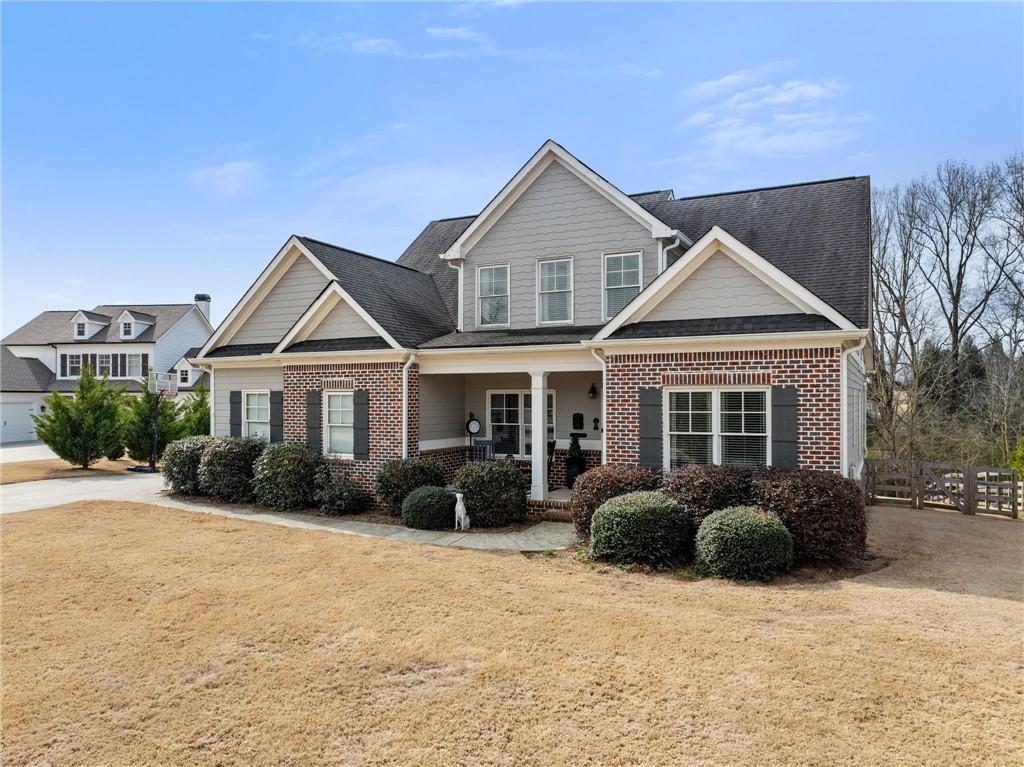 5716 Brickhampton Court Clermont, GA 30527 - Photo 5 of 42 a front view of a house with garden