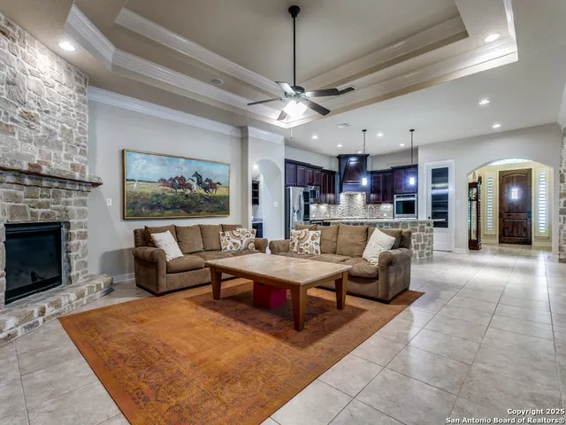 a living room with furniture and a fireplace