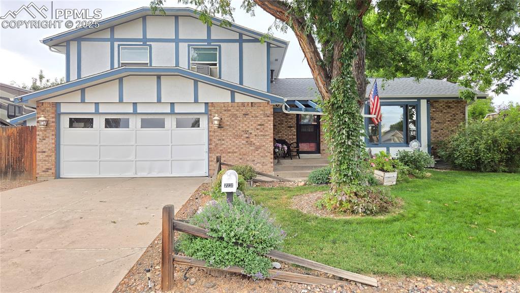 7231 South Webster Street Littleton, CO 80128 - Photo 1 of 44 a front view of a house with garden
