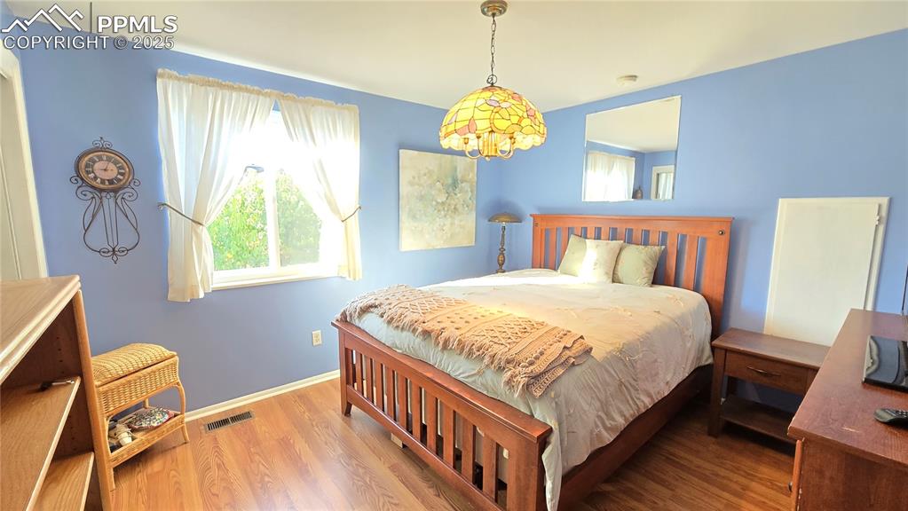 7231 South Webster Street Littleton, CO 80128 - Photo 17 of 44 a bedroom with bed and a window