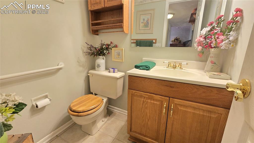 7231 South Webster Street Littleton, CO 80128 - Photo 24 of 44 a bathroom with a sink a toilet and a mirror