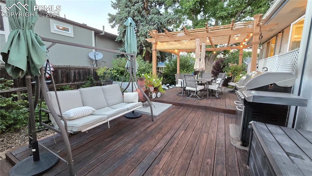 7231 South Webster Street Littleton, CO 80128 - Photo 34 of 44 a view of a patio with couches table and chairs and potted plants
