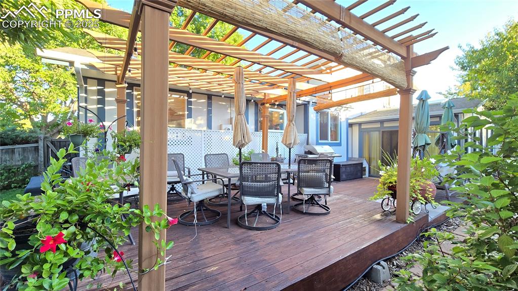 7231 South Webster Street Littleton, CO 80128 - Photo 37 of 44 a view of balcony with chairs and potted plant