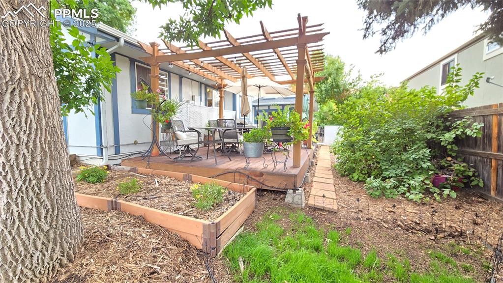 7231 South Webster Street Littleton, CO 80128 - Photo 38 of 44 a view of a chair and table in backyard of the house