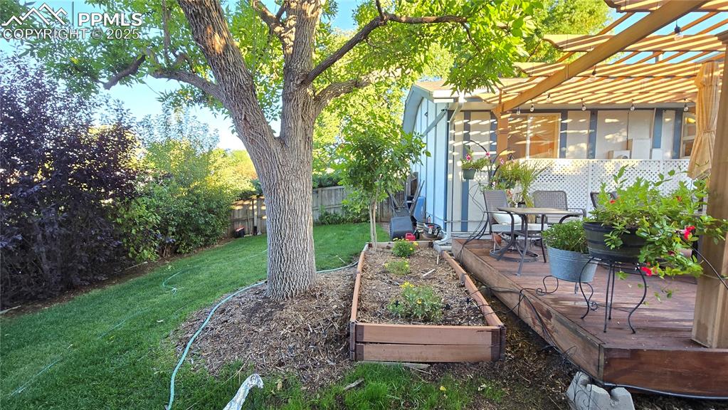 7231 South Webster Street Littleton, CO 80128 - Photo 39 of 44 a view of a house with backyard and sitting area