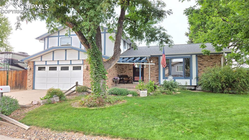 7231 South Webster Street Littleton, CO 80128 - Photo 44 of 44 a front view of a house with garden