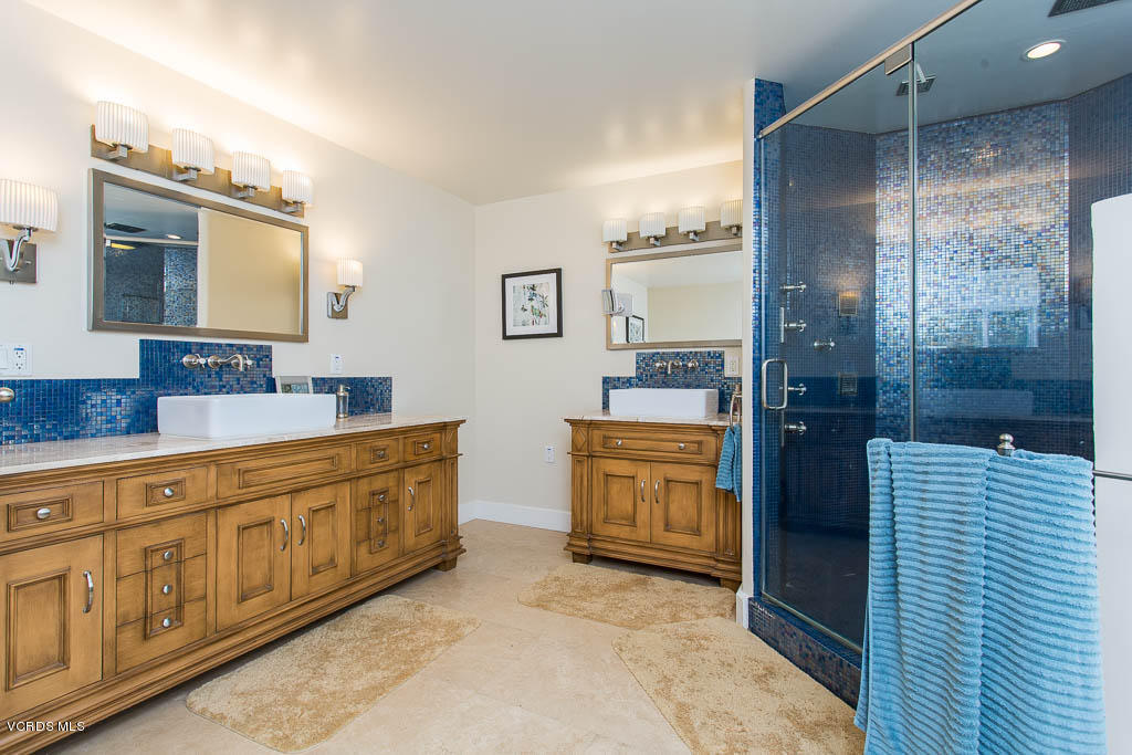 4043 Magna Carta Road Calabasas, CA 91302 - Photo 22 of 37 a spacious bathroom with a granite countertop sink mirror and shower