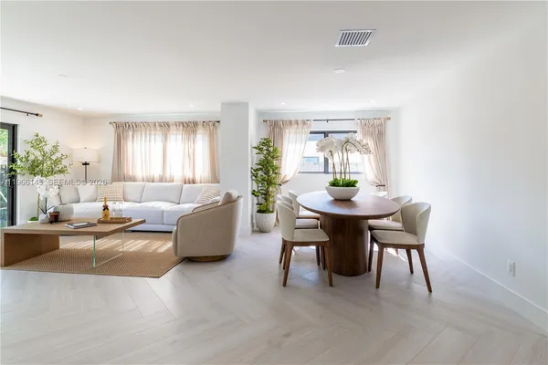 a living room with furniture and a table