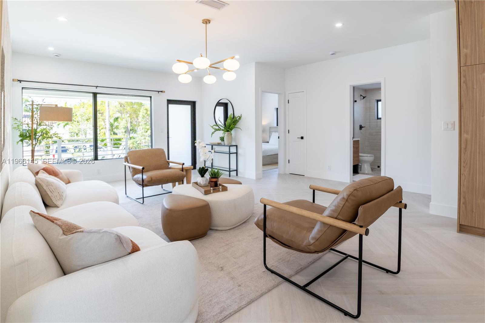 1420 Southwest 17th Street Miami, FL 33145 - Photo 2 of 49 a living room with furniture or chandelier and a large window