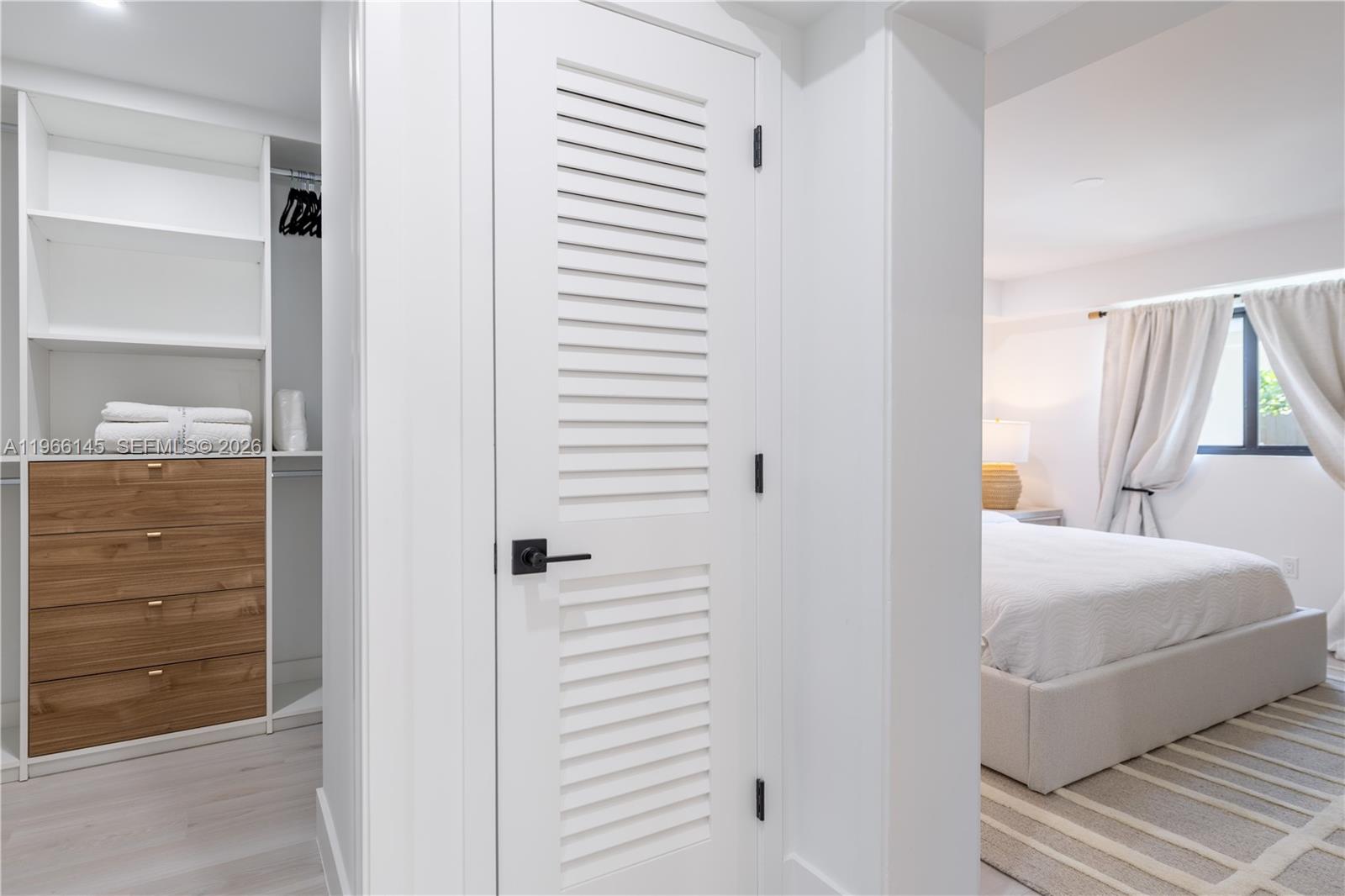 1420 Southwest 17th Street Miami, FL 33145 - Photo 26 of 49 a bedroom with a bed and a mirror