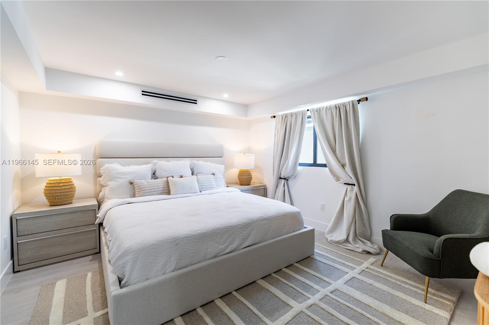 1420 Southwest 17th Street Miami, FL 33145 - Photo 27 of 49 a bedroom with a bed and a couch