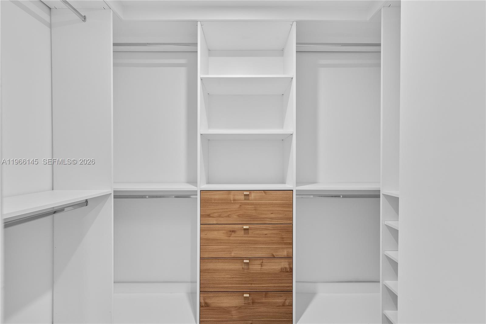 1420 Southwest 17th Street Miami, FL 33145 - Photo 29 of 49 a view of walk in closet with empty racks