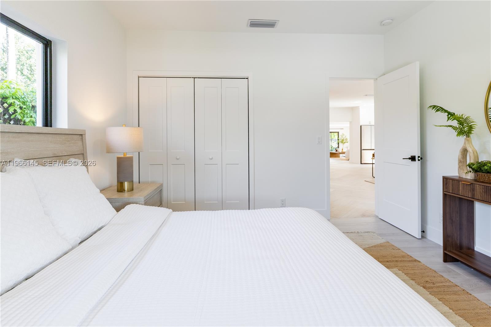 1420 Southwest 17th Street Miami, FL 33145 - Photo 35 of 49 a bedroom with a bed and a lamp