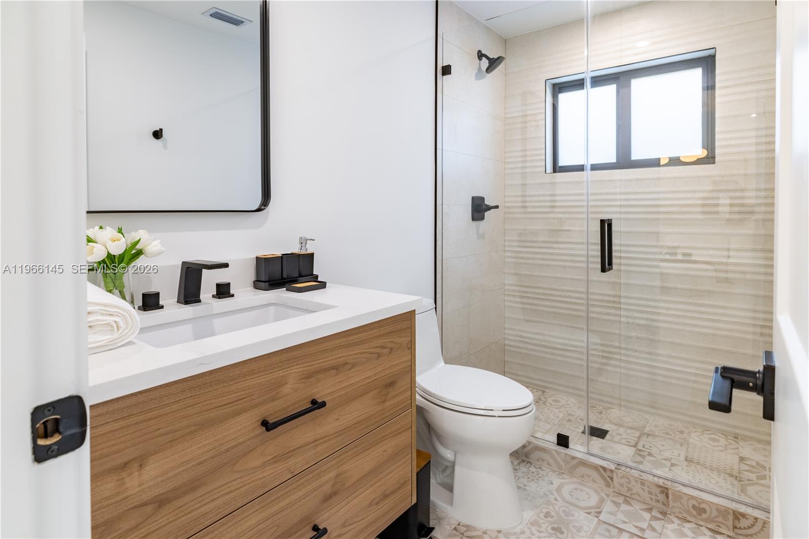 1420 Southwest 17th Street Miami, FL 33145 - Photo 36 of 49 a bathroom with a sink toilet and shower