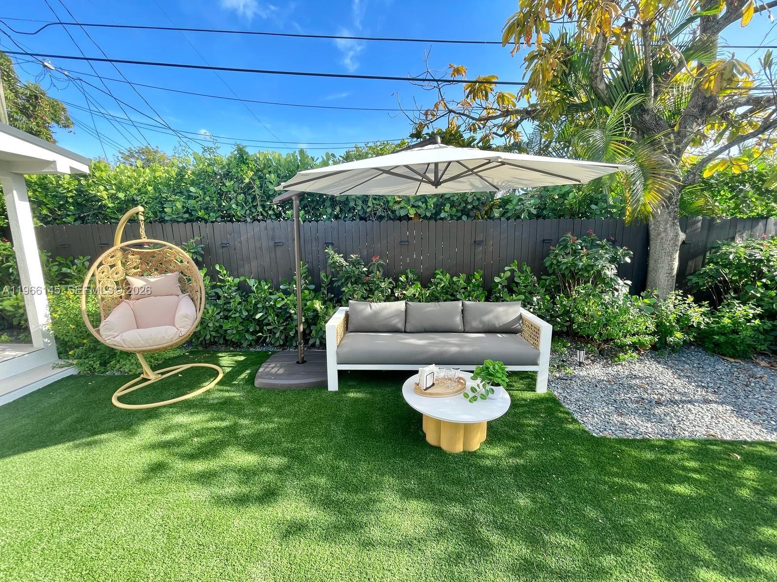 1420 Southwest 17th Street Miami, FL 33145 - Photo 40 of 49 a view of a chair and table in backyard of the house