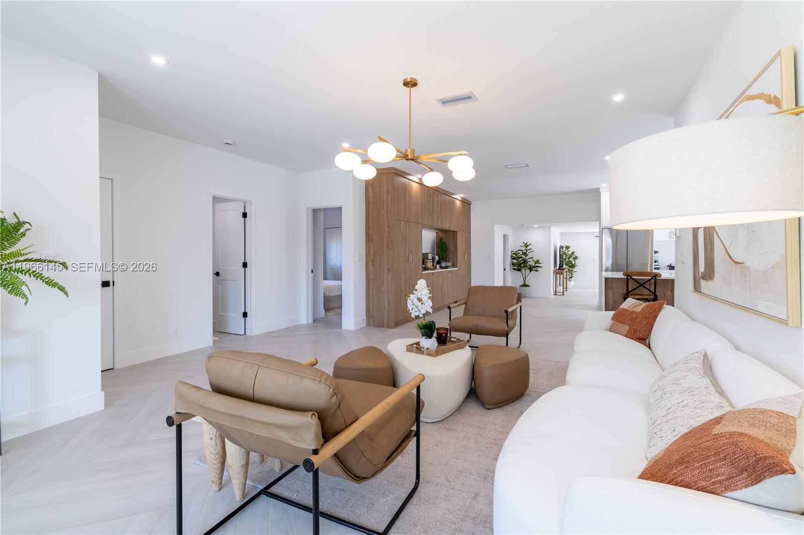 1420 Southwest 17th Street Miami, FL 33145 - Photo 4 of 49 a living room with furniture a chandelier and a fireplace
