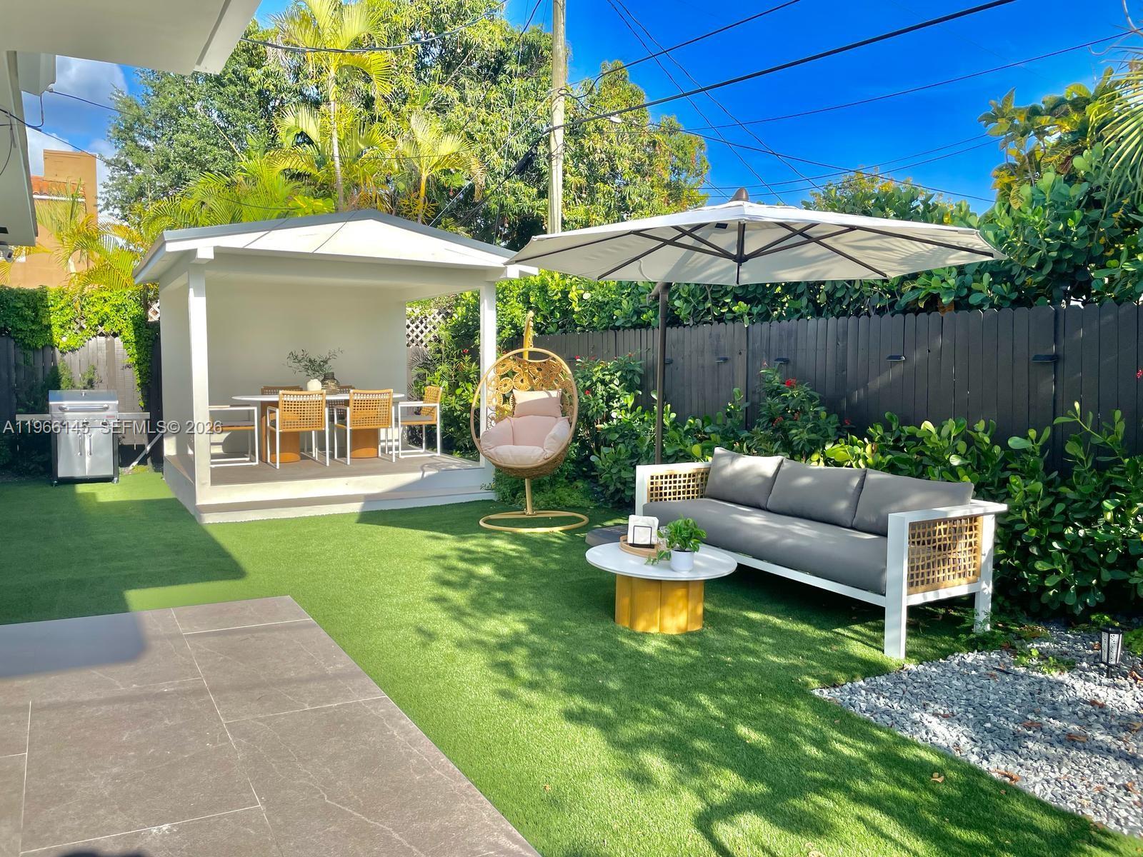 1420 Southwest 17th Street Miami, FL 33145 - Photo 41 of 49 a front view of a house with garden and sitting area