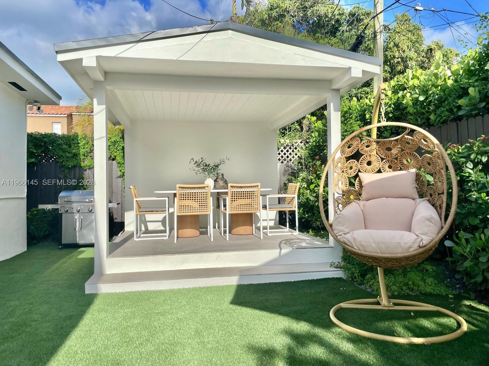 1420 Southwest 17th Street Miami, FL 33145 - Photo 42 of 49 a view of a house with backyard fountain and sitting area