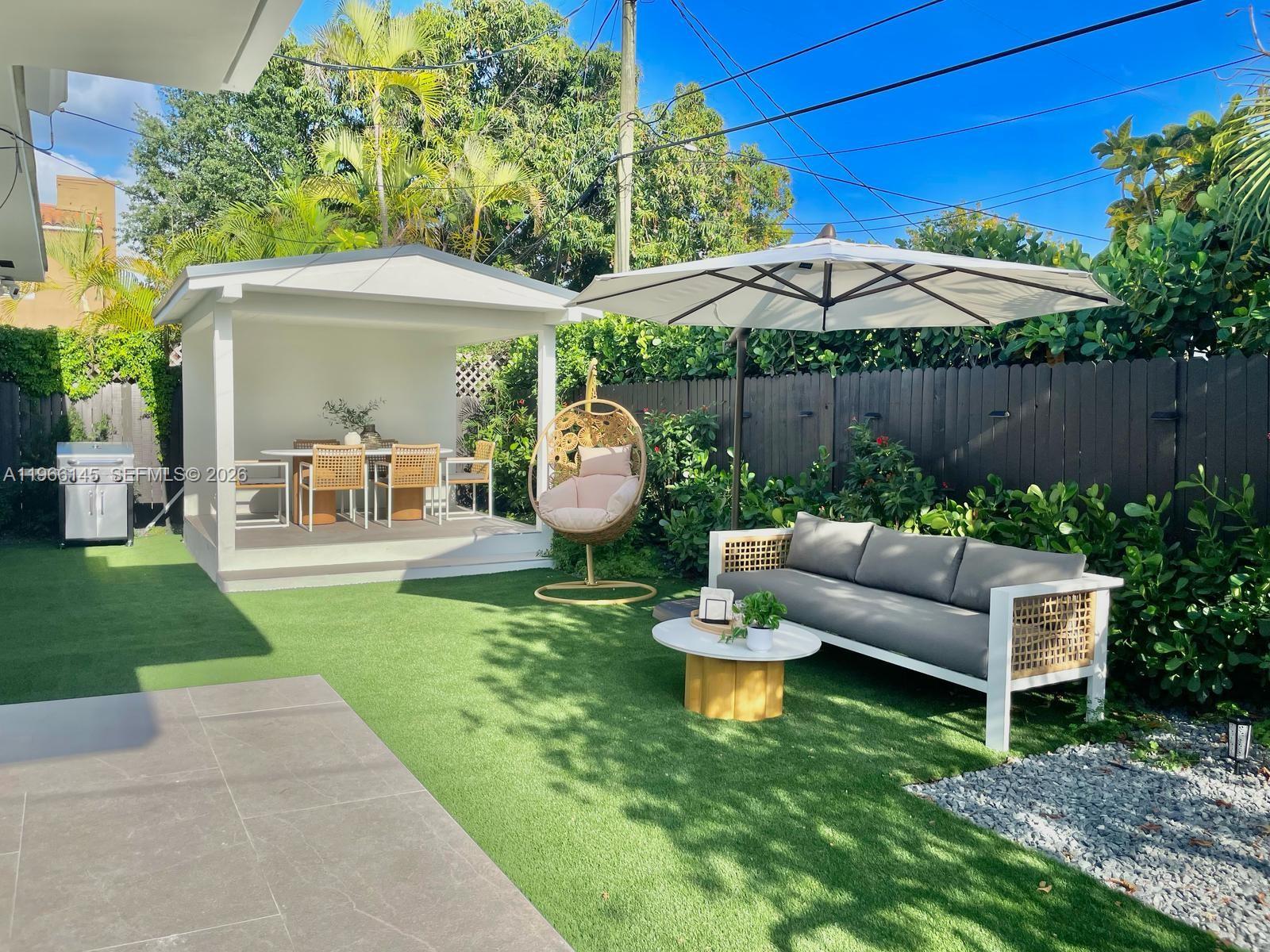 1420 Southwest 17th Street Miami, FL 33145 - Photo 43 of 49 a view of an house with backyard and furniture