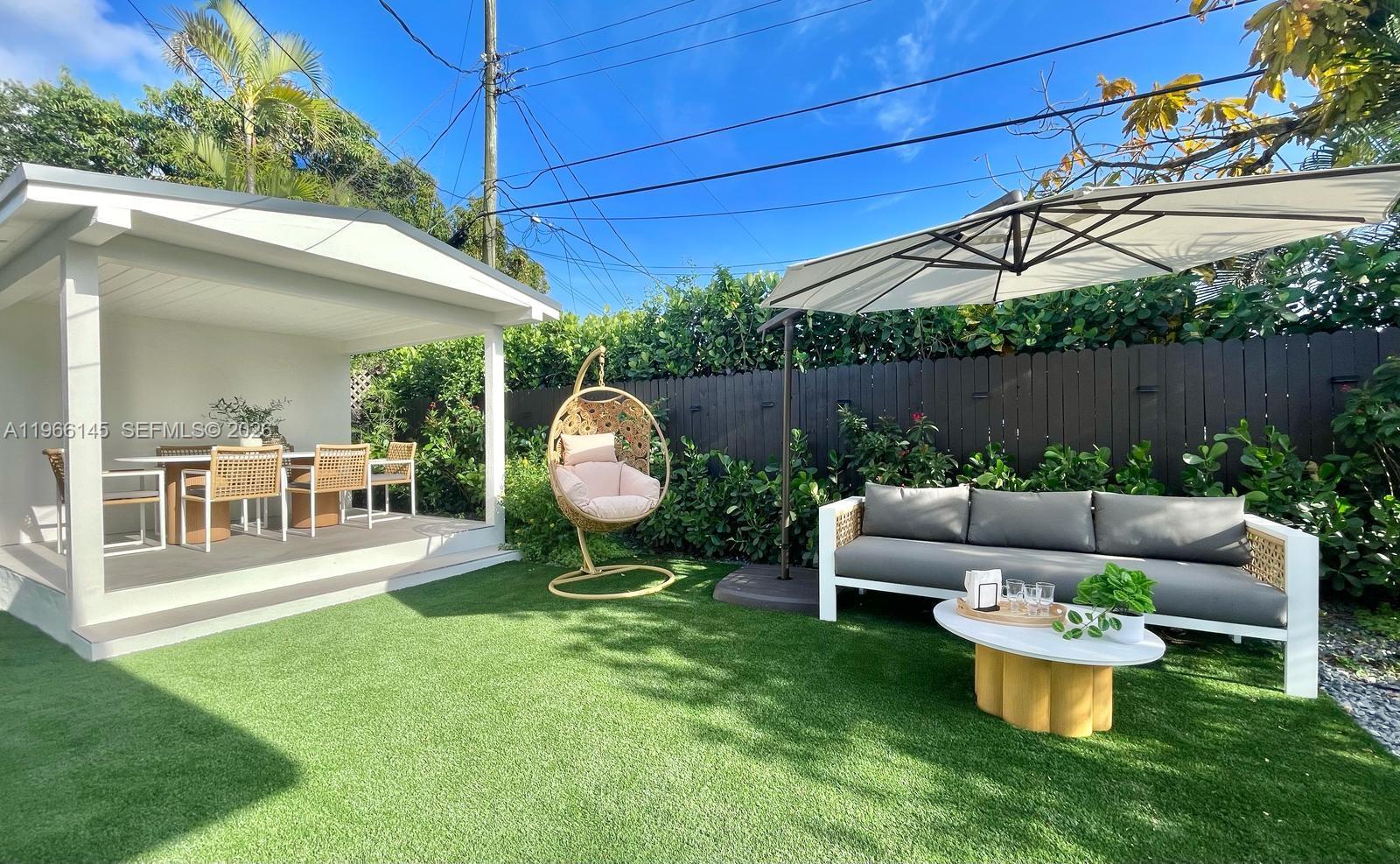 1420 Southwest 17th Street Miami, FL 33145 - Photo 45 of 49 a view of a backyard with couches table and chairs