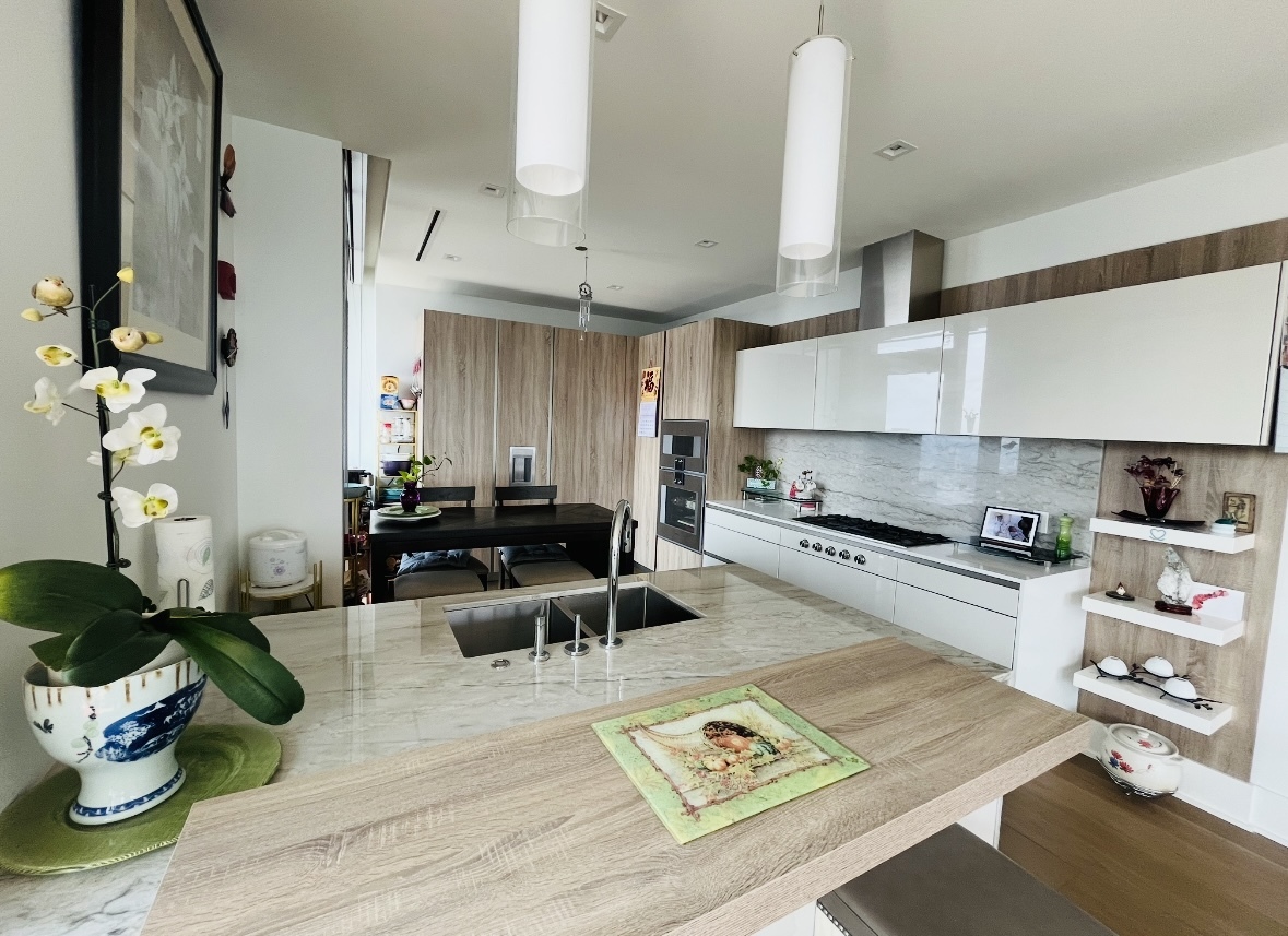 363 East Wacker Drive, Unit 4801 Chicago, IL 60601 - Photo 11 of 36 a kitchen with stainless steel appliances granite countertop a stove refrigerator and cabinets
