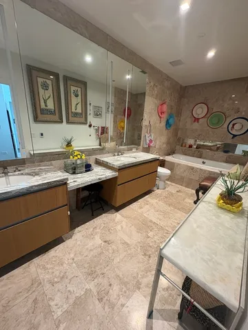 a kitchen with a sink and wooden cabinets