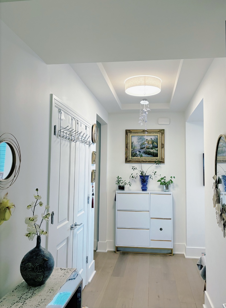 363 East Wacker Drive, Unit 4801 Chicago, IL 60601 - Photo 2 of 36 a living room with furniture and a painting on the wall