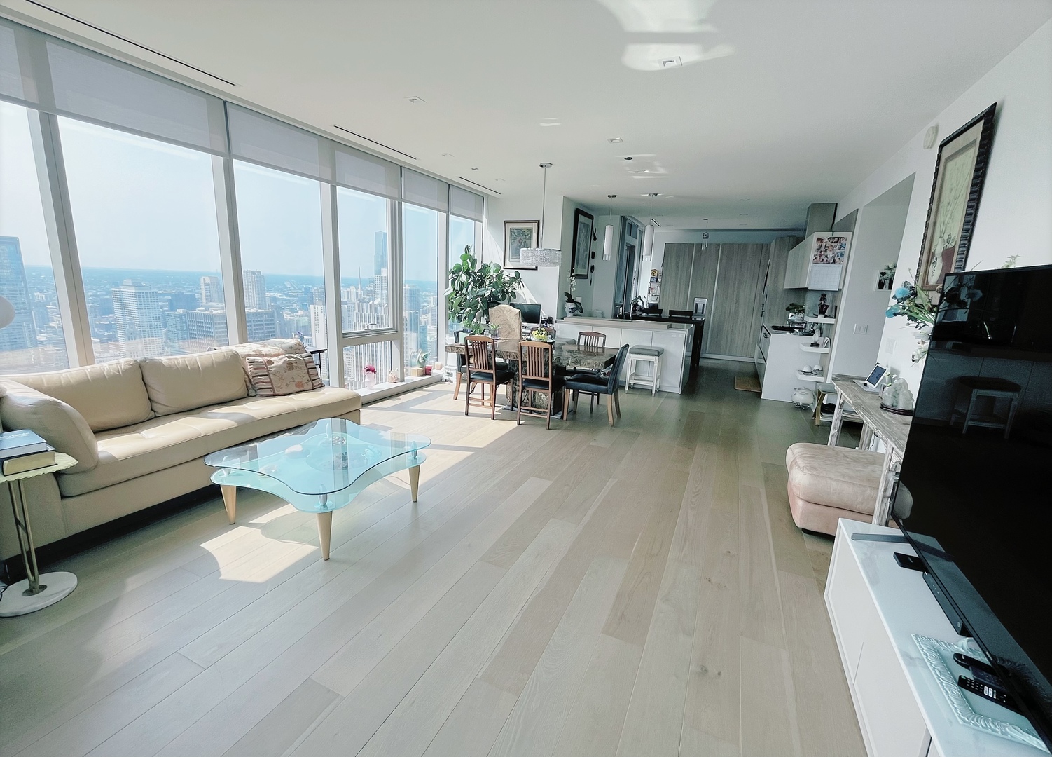 363 East Wacker Drive, Unit 4801 Chicago, IL 60601 - Photo 3 of 36 a living room with furniture and a large window