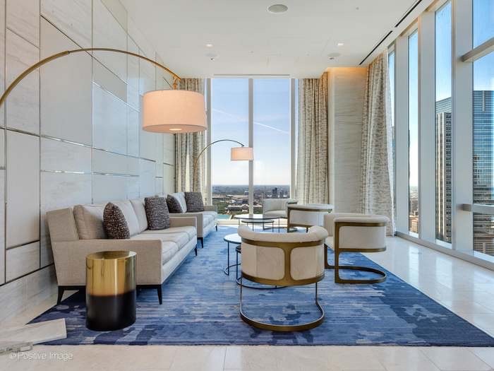 363 East Wacker Drive, Unit 4801 Chicago, IL 60601 - Photo 31 of 36 a living room with furniture and a large window