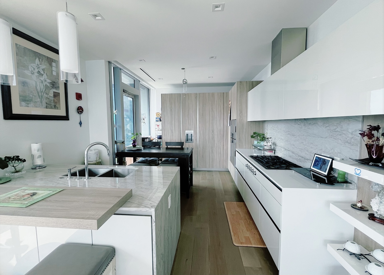 363 East Wacker Drive, Unit 4801 Chicago, IL 60601 - Photo 10 of 36 a kitchen with stainless steel appliances a sink a stove top oven a counter space and cabinets
