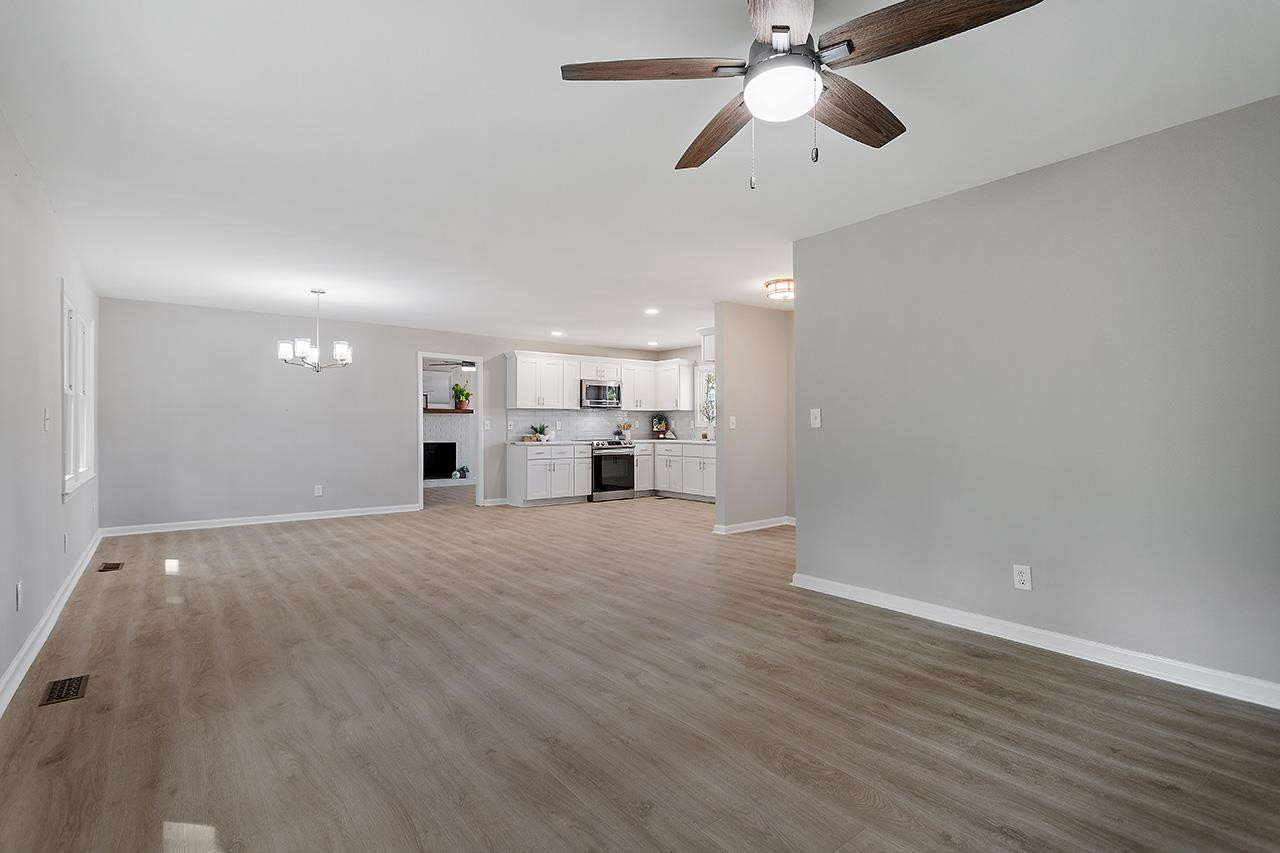 3420 Blue Ridge Road Raleigh, NC 27607 - Photo 14 of 36 a view of a kitchen with a sink and a window
