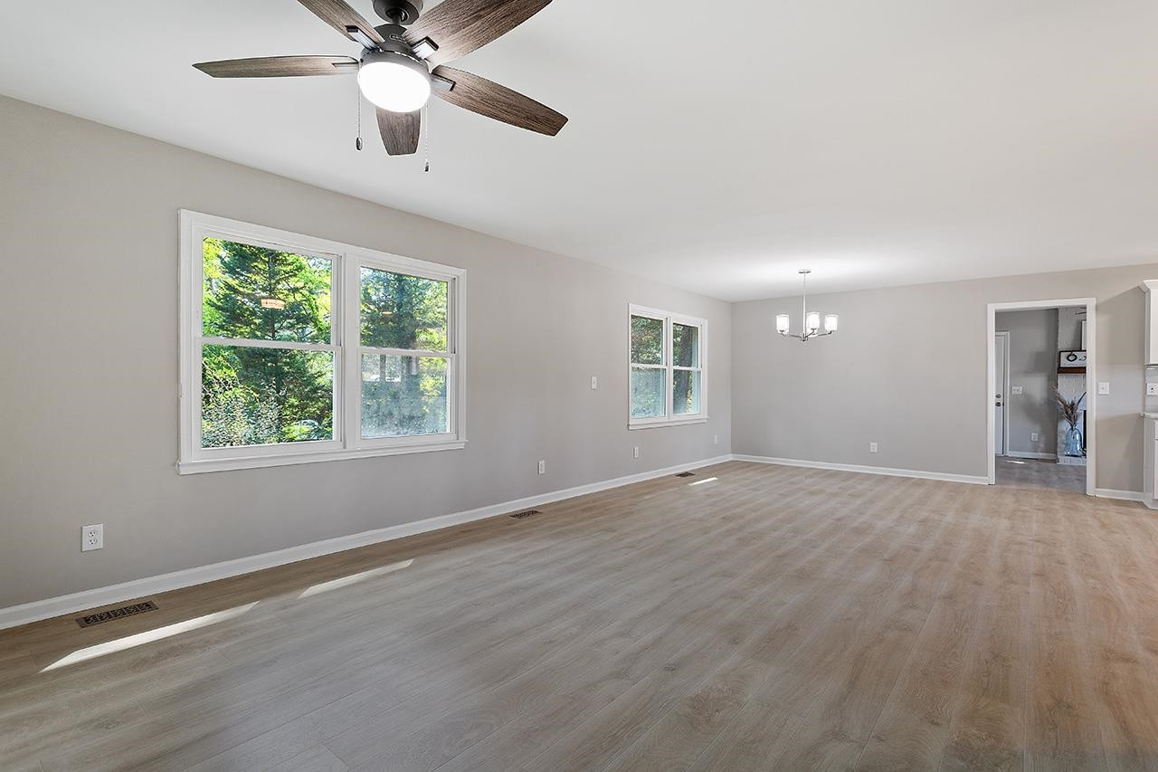 3420 Blue Ridge Road Raleigh, NC 27607 - Photo 16 of 36 a view of an empty room with a window