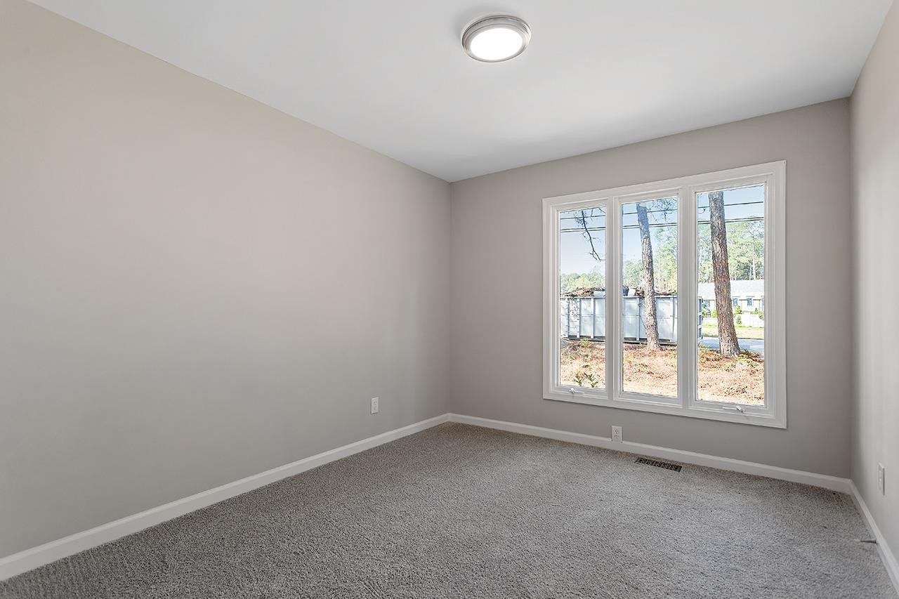 3420 Blue Ridge Road Raleigh, NC 27607 - Photo 23 of 36 an empty room with a window