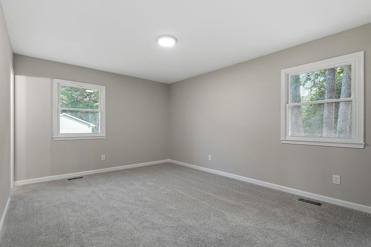 3420 Blue Ridge Road Raleigh, NC 27607 - Photo 26 of 36 an empty room with windows