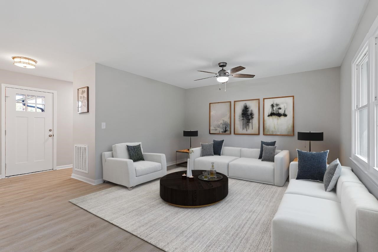 3420 Blue Ridge Road Raleigh, NC 27607 - Photo 3 of 36 a living room with furniture and a ceiling fan