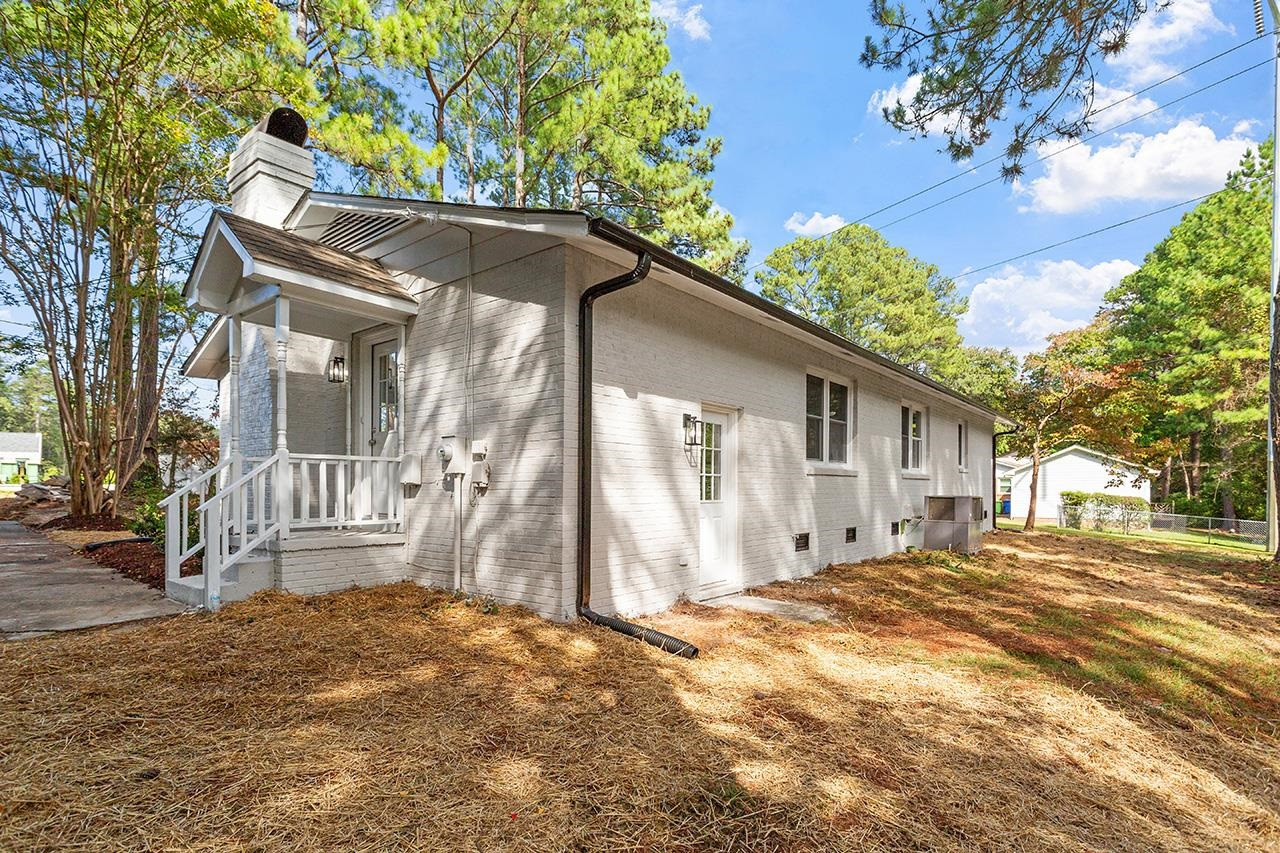 3420 Blue Ridge Road Raleigh, NC 27607 - Photo 32 of 36 a view of a house with a yard