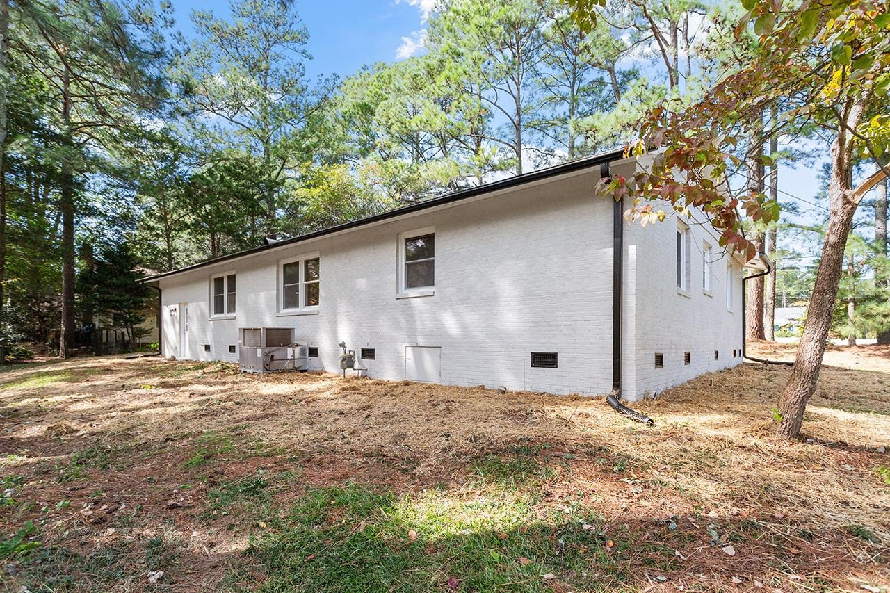 3420 Blue Ridge Road Raleigh, NC 27607 - Photo 33 of 36 a backyard of a house with table and chairs