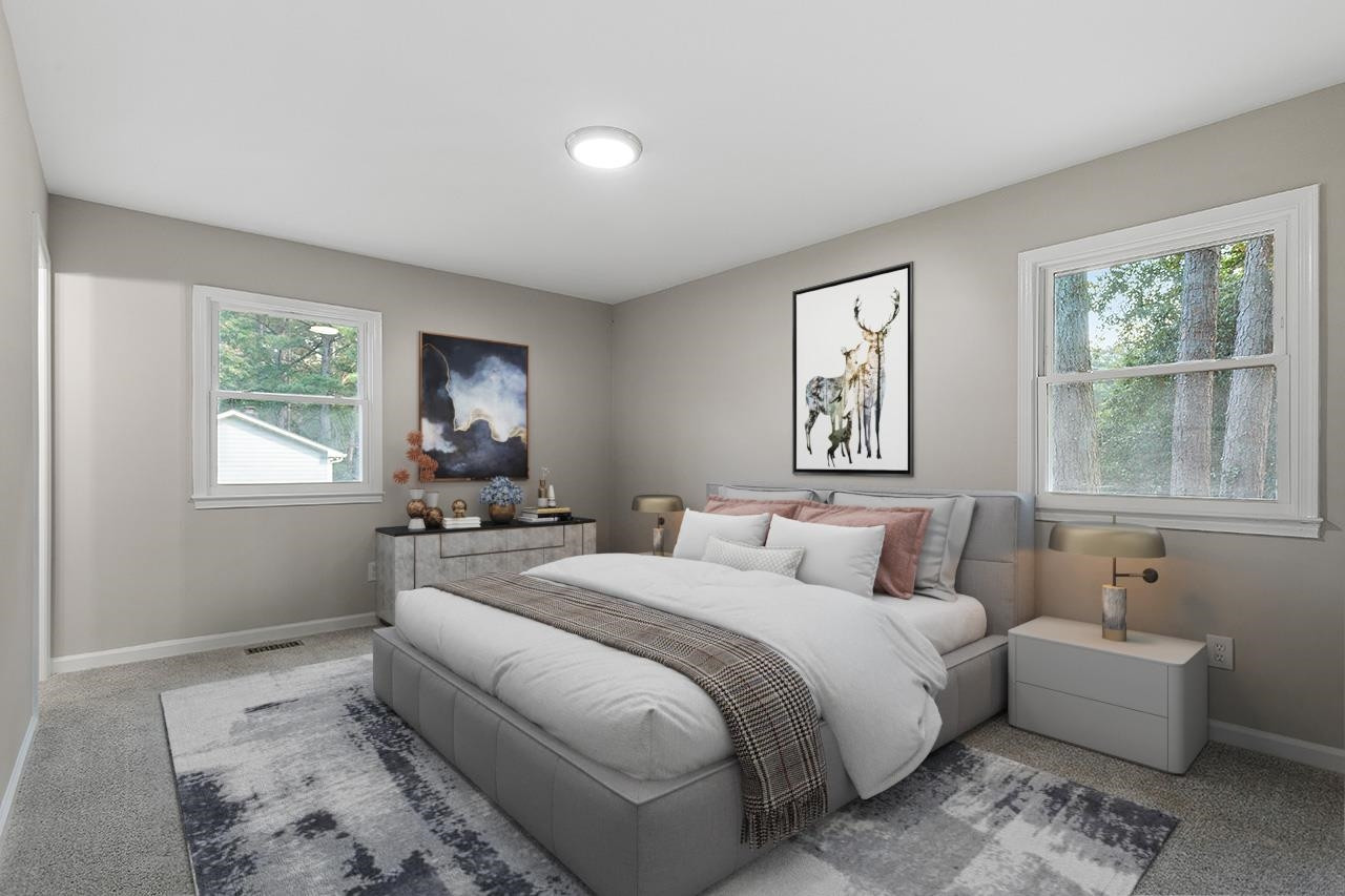 3420 Blue Ridge Road Raleigh, NC 27607 - Photo 7 of 36 a bedroom with double bed and a window