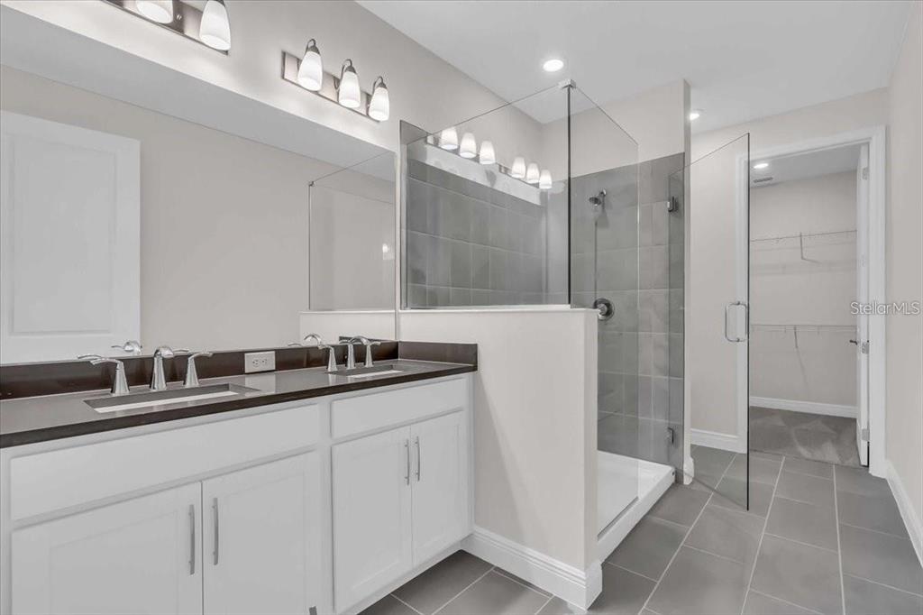 9258 Gulf Haven Drive Palmetto, FL 34221 - Photo 18 of 29 a bathroom with a double vanity sink mirror and double