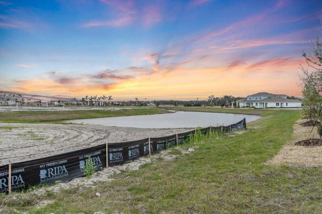 9258 Gulf Haven Drive Palmetto, FL 34221 - Photo 22 of 29 a view of a lake with houses in the background