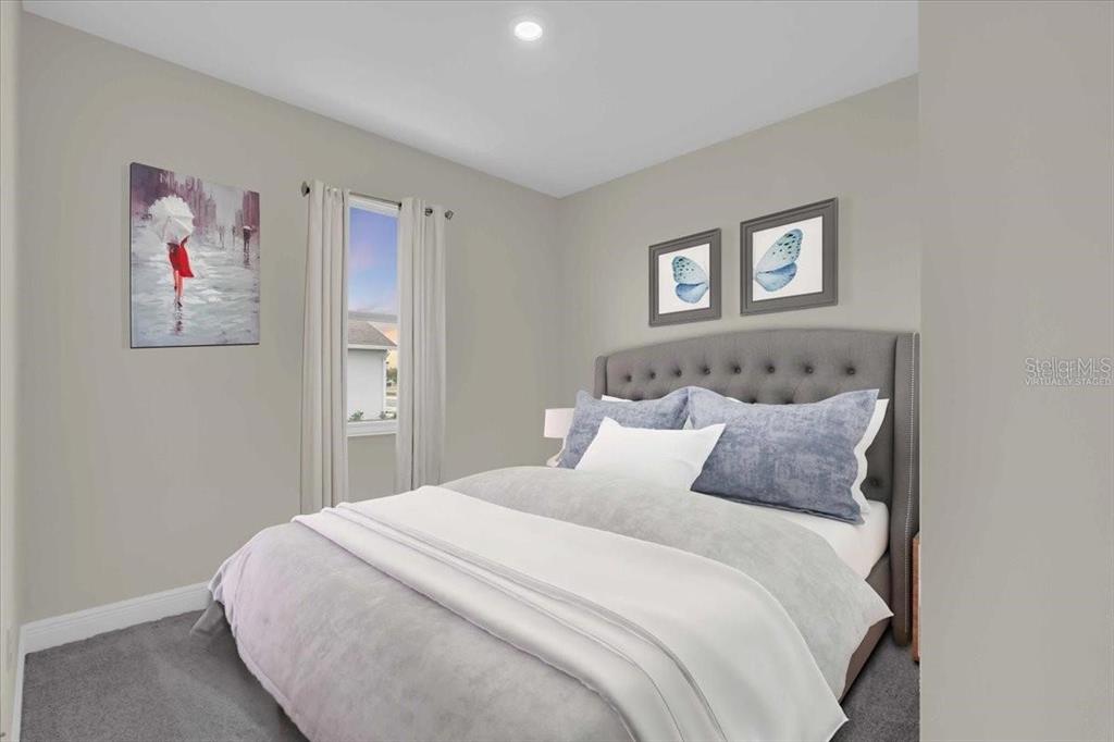 9258 Gulf Haven Drive Palmetto, FL 34221 - Photo 26 of 29 a bedroom with a bed and a window