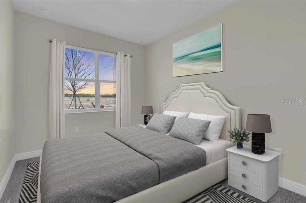 9258 Gulf Haven Drive Palmetto, FL 34221 - Photo 27 of 29 a bedroom with a bed and a night stand