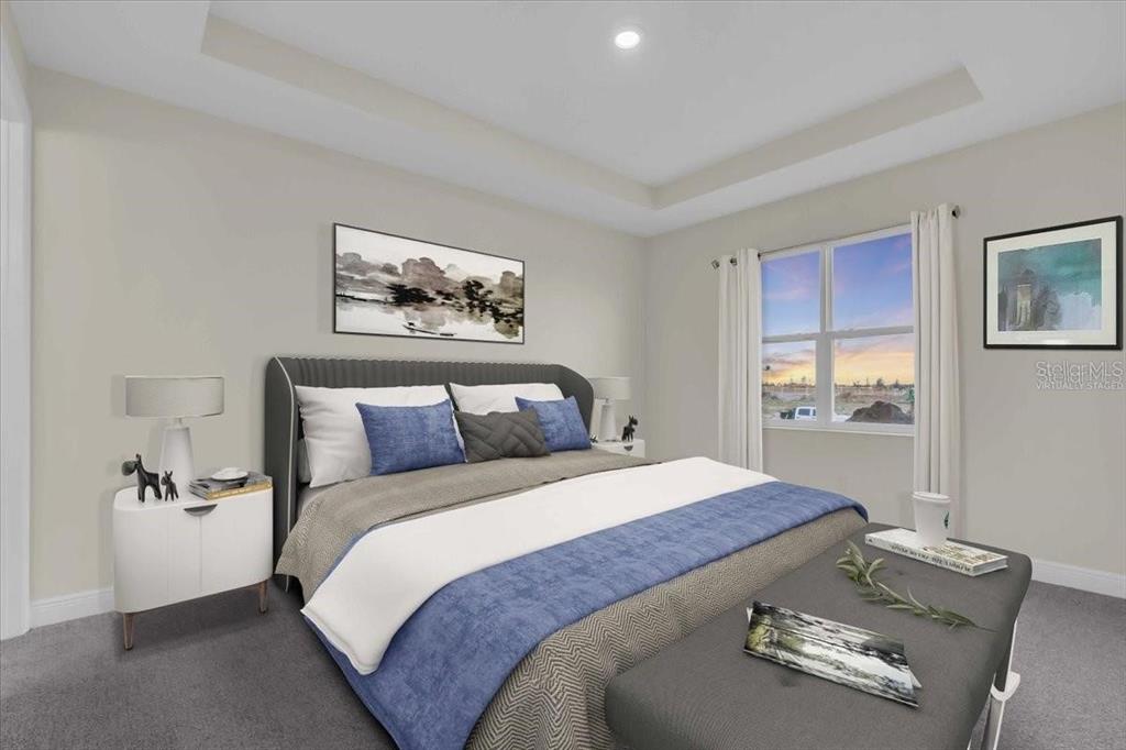 9258 Gulf Haven Drive Palmetto, FL 34221 - Photo 28 of 29 a bedroom with a bed and a painting on the wall